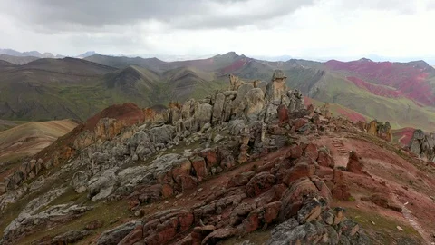 Aerial drone view of red clored mountain stones in Vinicunca, Rainbow Mountain Stock Footage 105887752