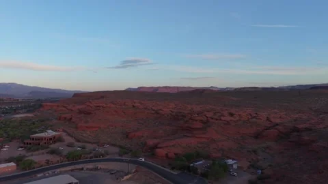Aerial drone view of red rock cliffs at sunrise in St George, Utah Stock Footage 333920320