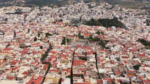 Aerial drone view of red-tiled old town rooftops and the Neratze Mosque minaret Stock Footage 339288416