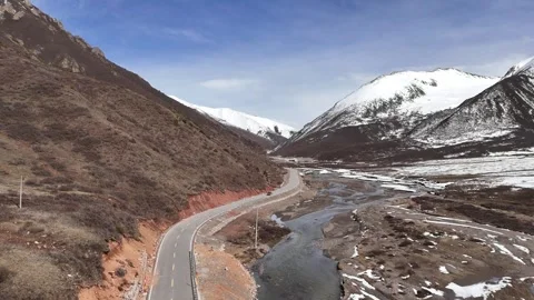 Aerial drone view of remote mountain road in western China Stock Footage 337900305