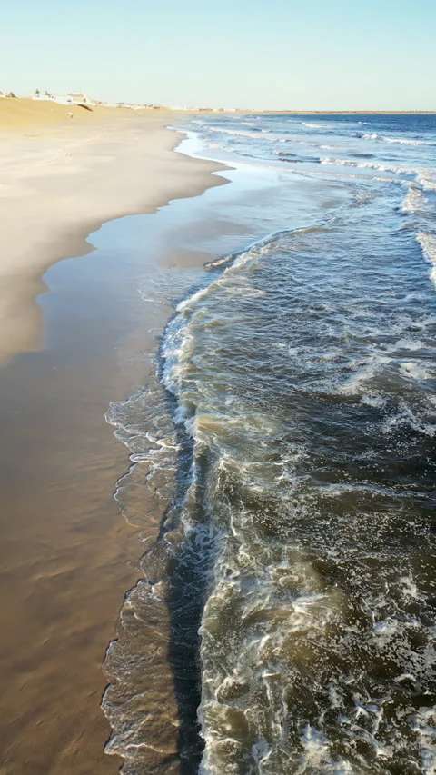 Aerial drone view of the remote Skeleton Coast shoreline in Namibia showing 스톡 동영상 330794525