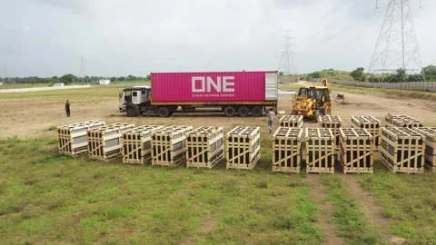 Aerial drone view of renewable solar power panels unloading from container. Stock Footage 314704351