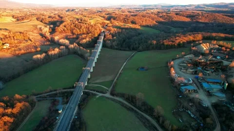 Aerial drone view reverse 4K High speed railbridge Tuscany Valdarno Italy Stock Footage 191201916