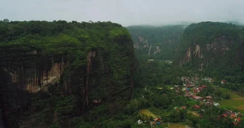 Aerial drone view of rice terraces on mountain cliff with soft morning fog Stock Footage 333614341