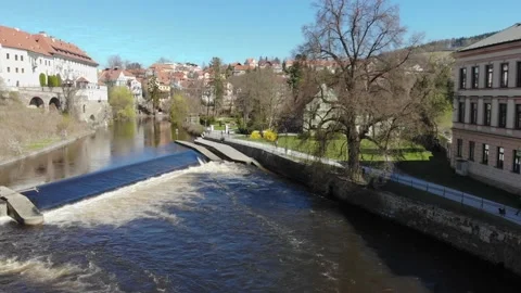 Aerial drone view of the river and historic houses of the Czech city Stock Footage