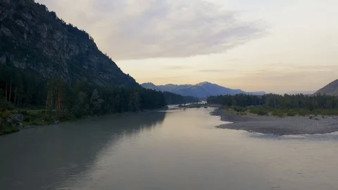 Aerial drone view of the river between tree forest at sunset. Altai Russia. Stock Footage 121387550
