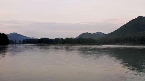 Aerial drone view of the river between tree forest at sunset. Altai Russia. Stock Footage 121389874