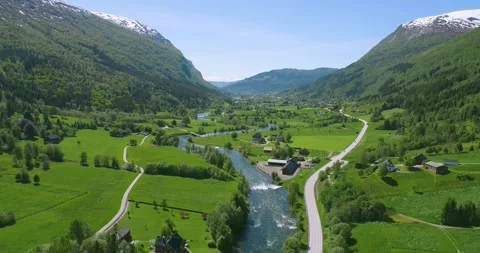 Aerial Drone View of a River Snaking through a town in Norway (Stryn) Stock Footage 247378086