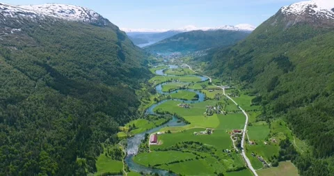 Aerial Drone View of a River Snaking through a town in Norway (Stryn) Stock Footage 247378129