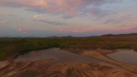 Aerial drone view of a river at sunset in Costa Rica Stock Footage 319509456