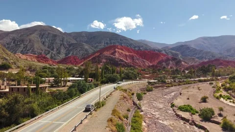 Aerial drone view of road and colorful mountains in Purmamarca, Salta, Argentina Stock Footage 332172696