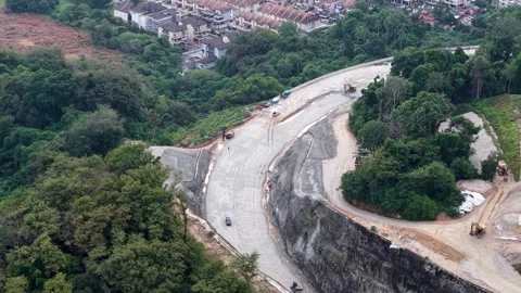 Aerial drone view of road construction at Paya Terubong Video stock 332739595