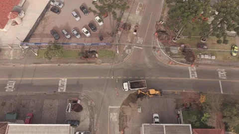 Aerial drone view of road construction excavator loading dump truck at urba.. Stock-Footage 336550110