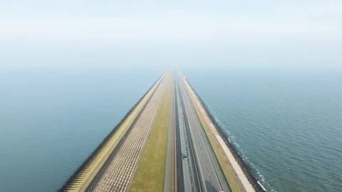 Aerial drone view of road on a dike between two seas in the Netherlands. Stock Footage 337350299