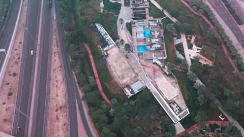 Aerial Drone View of Road Intersection and Green Landscaped Park Area in Kuwait Stock Footage 325845046