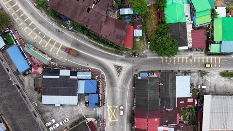 Aerial drone view of road intersection in Kubang Semang town Видео 329369996