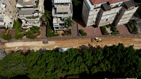 Aerial drone view of road paving and infrastructure repair works in Rehovot Stock Footage 341053565