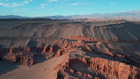 Aerial drone view of road winding through arid rocky landscape in Atacama d.. Stock Footage 337688941