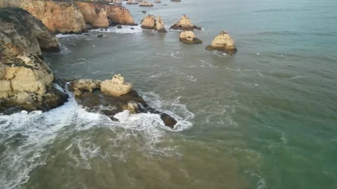 Aerial drone view of Rocha do Leao, Praia do Vau and Ponta Joao de Arens Stock Footage 167923685