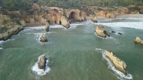 Aerial drone view of Rocha do Leao, Praia do Vau and Ponta Joao de Arens Stock Footage 167923796