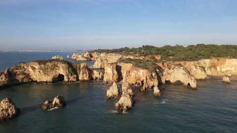 Aerial drone view of Rocha do Leao, Praia do Vau and Ponta Joao de Arens Stock Footage 167924484