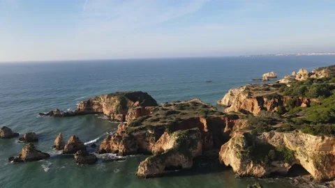 Aerial drone view of Rocha do Leao, Praia do Vau and Ponta Joao de Arens Stock Footage 167924506