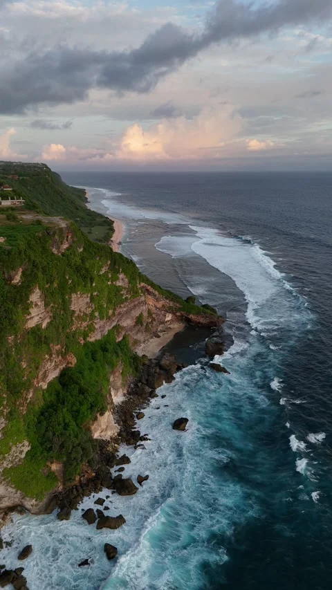 Aerial Drone View of Rocky Cliff Coastline at Sunset in Uluwatu, Bali, Indonesia Stock Footage 328719326