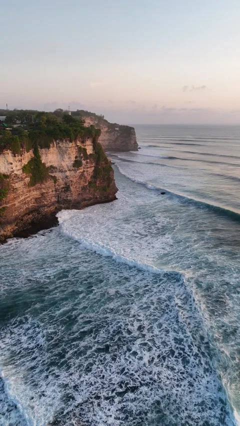 Aerial Drone View of Rocky Cliff Coastline at Sunset in Uluwatu, Bali, Indonesia Stock Footage 331519285