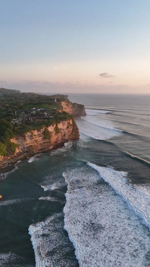 Aerial Drone View of Rocky Cliff Coastline at Sunset in Uluwatu, Bali, Indonesia Stock Footage 331522044