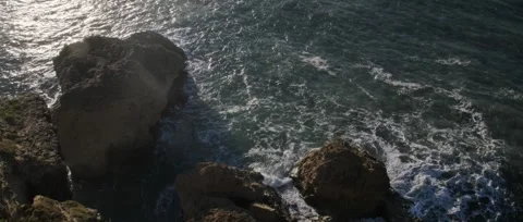 Aerial drone view of rocky cliffs and Atlantic Ocean in Nazaré, Portugal. Stock Footage 329118960
