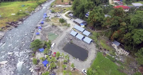 Aerial Drone View of Rocky Riverbed and Settlement, Sabah Borneo 스톡 동영상 335475137