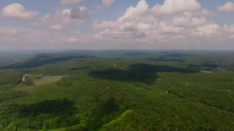 Aerial drone view of rolling forested hills with cloud shadows in Peekskill Vídeo Stock 316018157