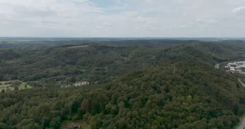 Aerial Drone View of Rolling Green Hills, Dense Forest and Scenic Countryside Stockbeeldmateriaal 330107080