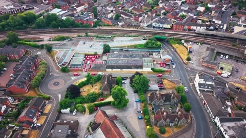 Aerial Drone View of Royal Mail Delivery Yard and Terraced Houses in English Stock Footage 344012722