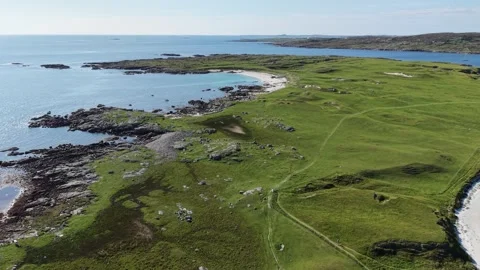 Aerial drone view of the rugged Atlantic coastline near Dog’s Bay Stock Footage 343939490