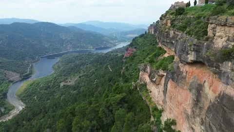 Aerial Drone View of Rugged Cliffs and River Landscape in Siurana, Catalonia Stockbeeldmateriaal 334836446