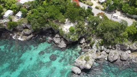 Aerial drone view of the rugged limestone cliffs in West End, Negril, Jamaica Stockbeeldmateriaal 331569880