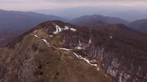 Aerial Drone View of Rugged Lisec Peak and Forested Ridge on Plackovica Mountain Stock Footage 336286804