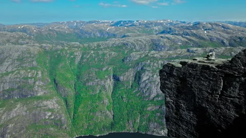 Aerial drone view of rugged mountain cliffs at Kjerag above Lysefjord in Norway. Stock Footage 328129702