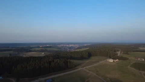 Aerial drone view of rural countryside landscape with bright sky and horizon Stock Footage 330736853