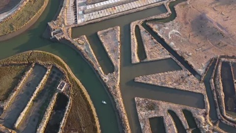 Aerial drone view of salt fields in Portugal. Sunset cinematic shot. Video stock 171816483