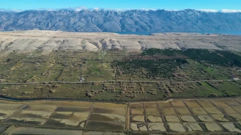 Aerial drone view of Salt Fields in Solana Pag, Croatia Stock Footage 231795543