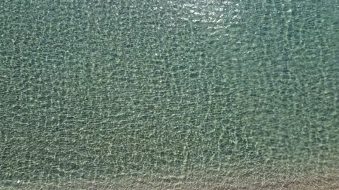 Aerial drone view of sandy beach and sea in summer. Soft waves. Stock Footage 285270021