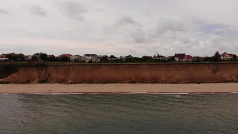 Aerial Drone View on Sandy Beach, High Cliff, Light Sea Waves in Summer Day 스톡 동영상 300673533