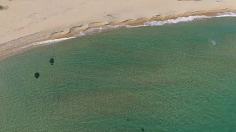 Aerial drone view of sandy beach shoreline and turquoise sea Stock Footage 321331124