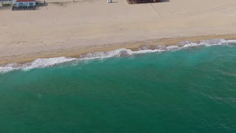 Aerial drone view of sandy beach shoreline and turquoise sea Stock Footage 321331300