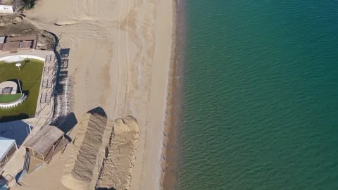 Aerial drone view of sandy beach coastline with clear turquoise water Stock Footage 321966656