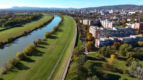 Aerial drone view of Sava river and Zagreb skyline on sunny autumn day, Zagreb Stock Footage 324610240