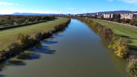Aerial drone view of Sava river and Zagreb skyline on sunny autumn day, Zagreb Stock Footage 324610352