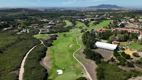 Aerial drone view of a scenic golf course in Portugal on a sunny day Stock Footage 286222033